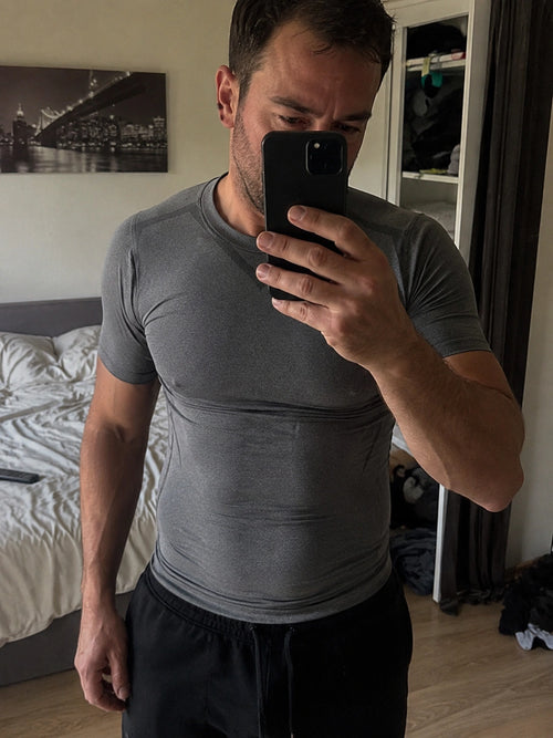DEFYNMEN compression undershirt worn in an everyday setting