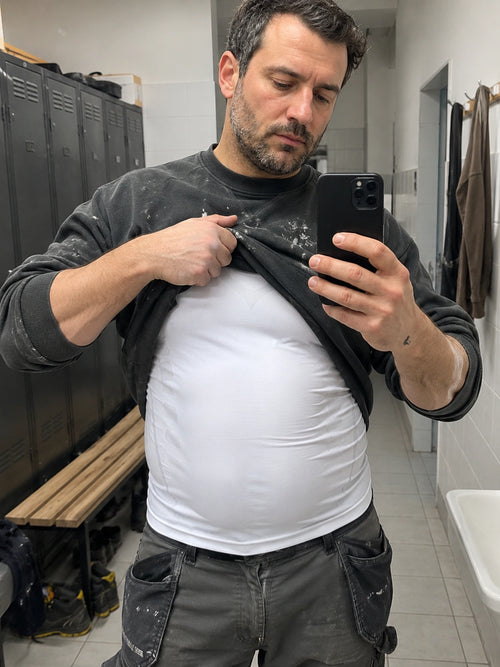 DEFYNMEN compression undershirt worn in an everyday setting